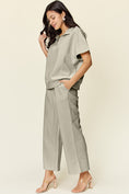 Load image into Gallery viewer, Double Take Full Size Texture Half Zip Short Sleeve Top and Pants Set
