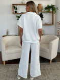 Load image into Gallery viewer, Double Take Full Size Texture Half Zip Short Sleeve Top and Pants Set
